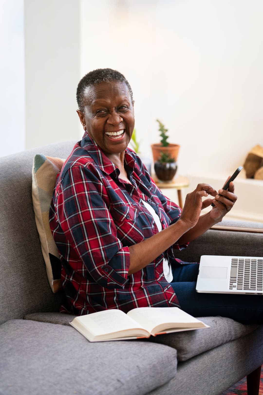 Smiling woman using laptop